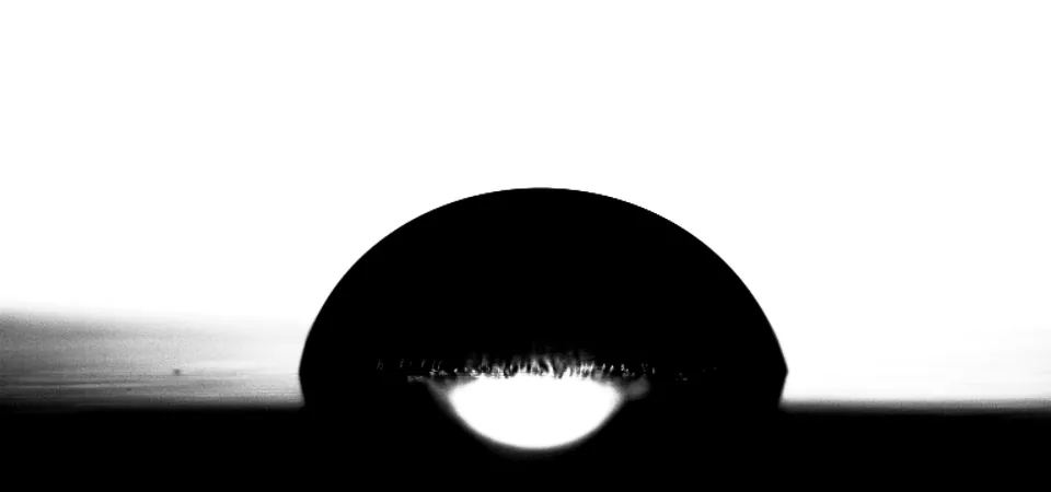 Water drop on aluminum at 68.8 °C, close to a hemisphere.