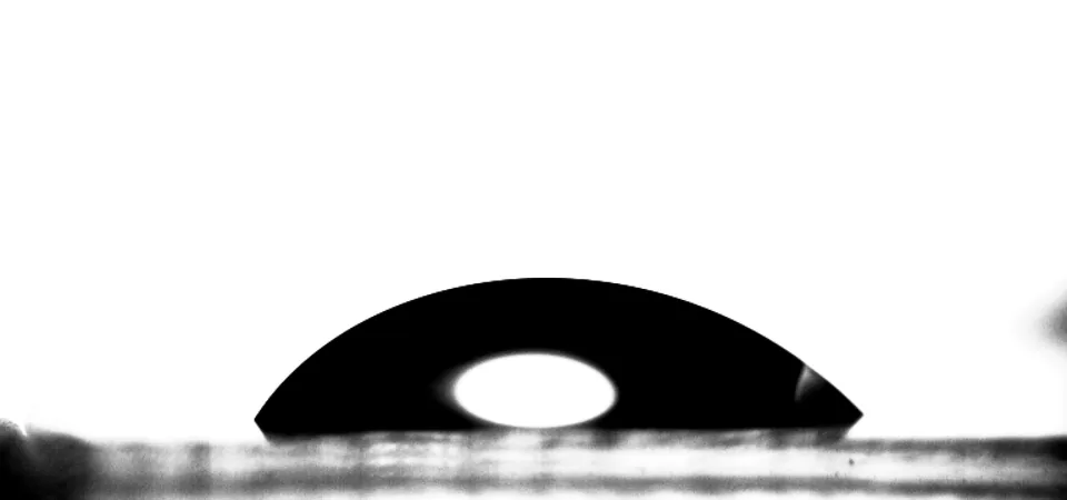 Water drop on glass at 73.8 °C, a cap of similar height.